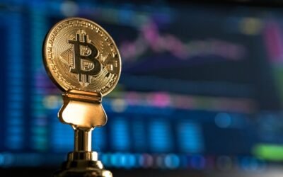 Bitcoin coin near a rising price chart on a monitor, representing technical analysis