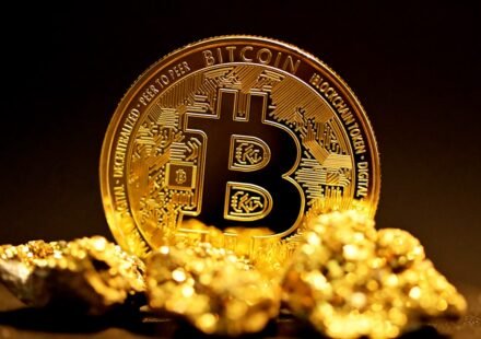 Bitcoin sitting on gold nuggets representing corporate treasury strategy