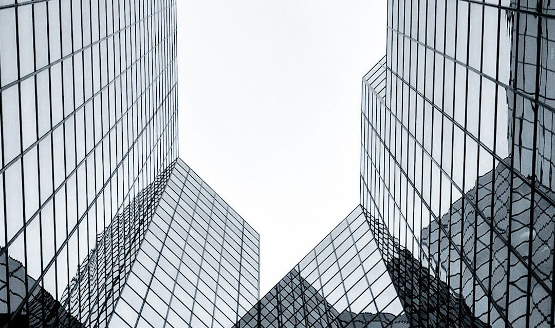 Glass corporate office building representing public companies with Bitcoin treasuries
