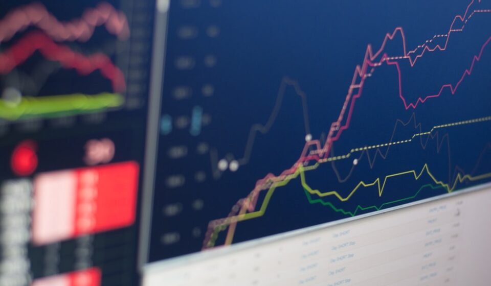 Trading monitor displaying market graph representing new altcoin ETF launches